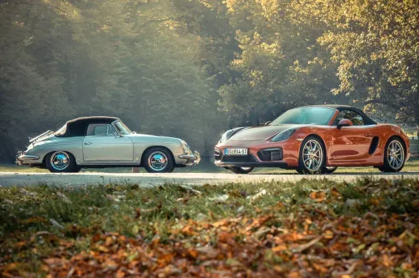An old 60s Porsche next to a modern Porsche 911.