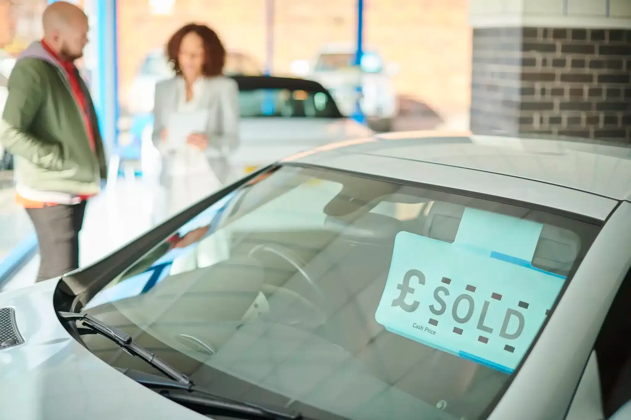 sold car in dealership showroom